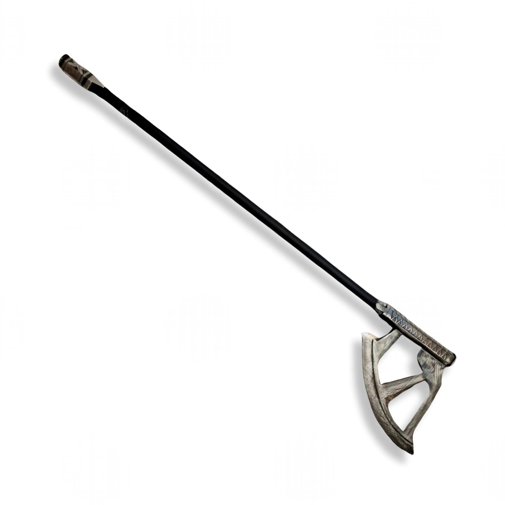 A long-handled axe or mace with a dark handle and a weathered silver-gray metal head, shown diagonally on a plain white background.