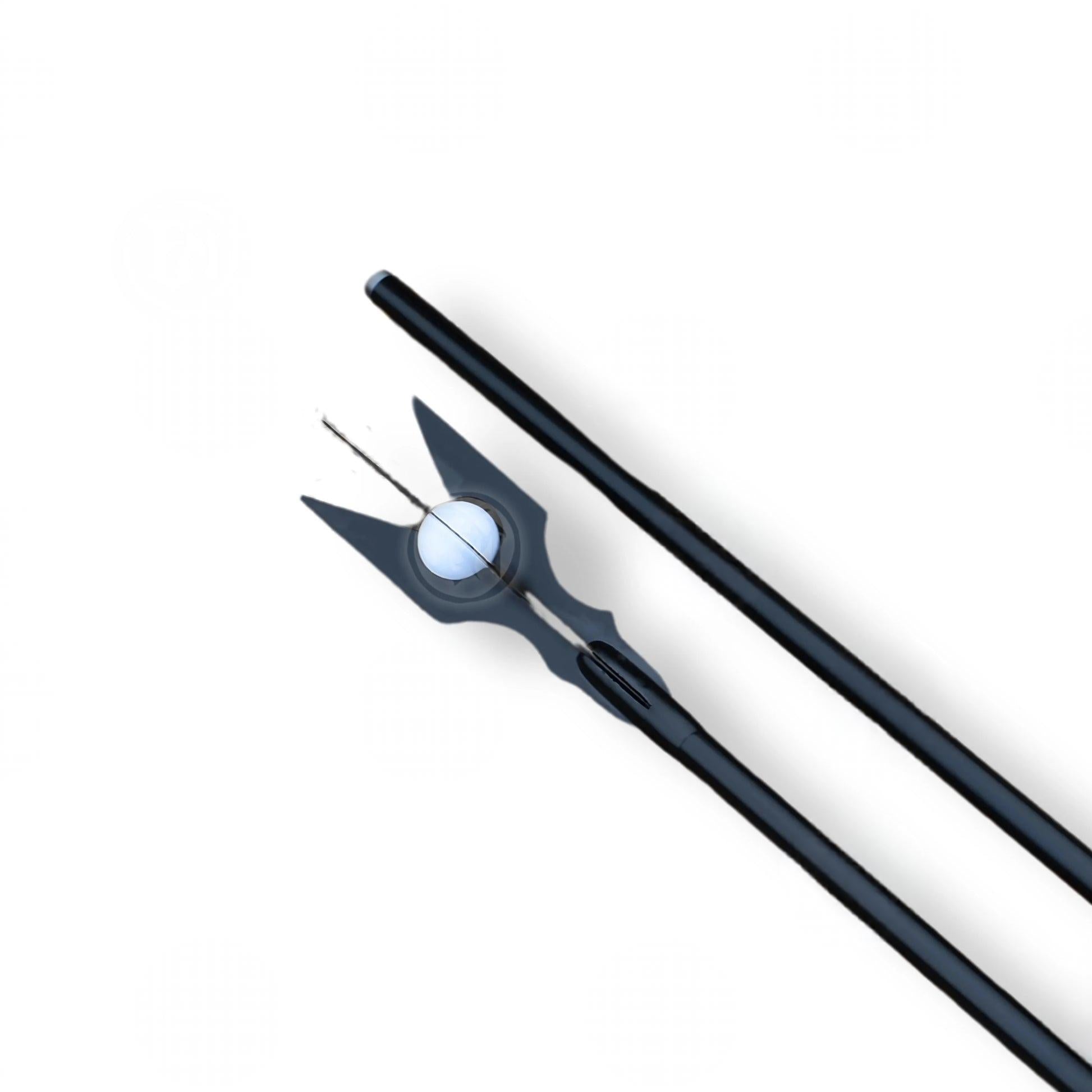 Saruman's Black Wizard Staff replica from The Lord of the Rings featuring a dark carved design with an ornate crown top.
